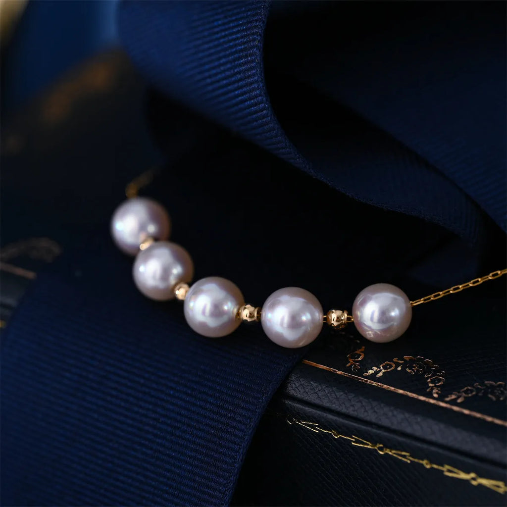 Sky Star 18K gold pearl necklace with round sea pearl 7.5-8mm and adjustable 45cm chain on white background