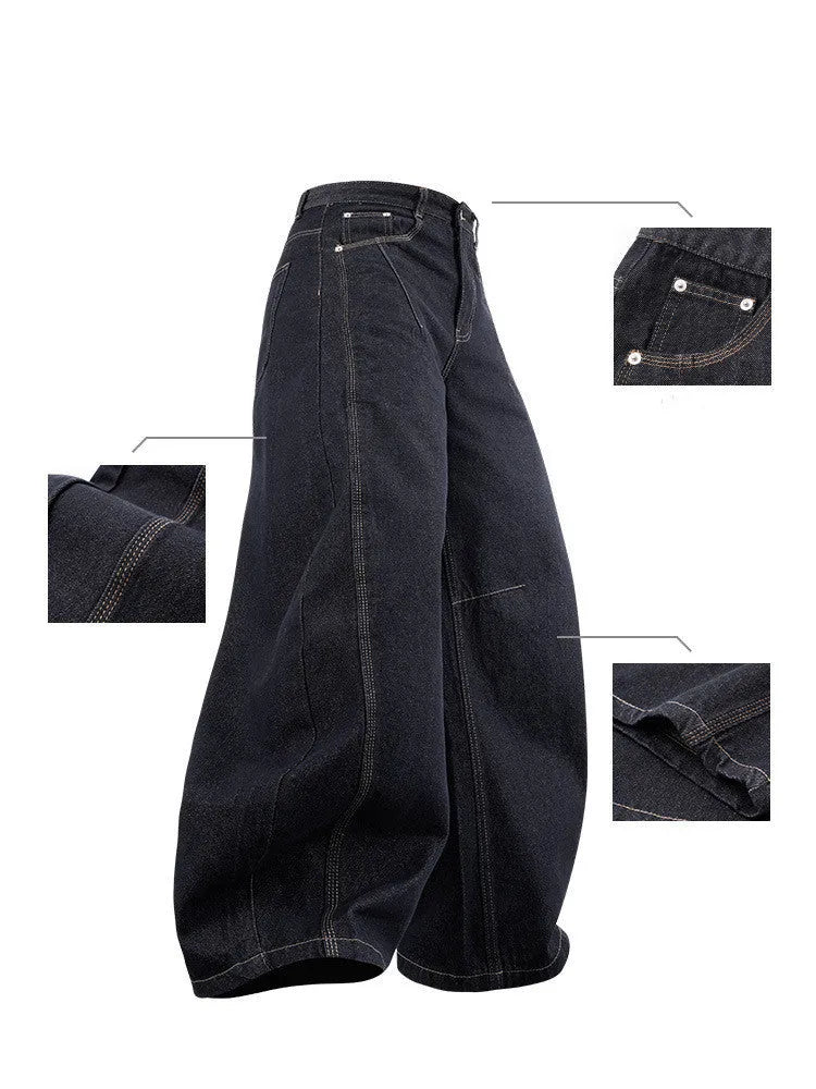 Men's original cow colour wide leg denim trousers laid flat showing mid-waist and relaxed leg cut