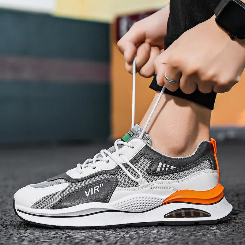 Men's grey breathable mesh running shoes with EVA sole and round toe design