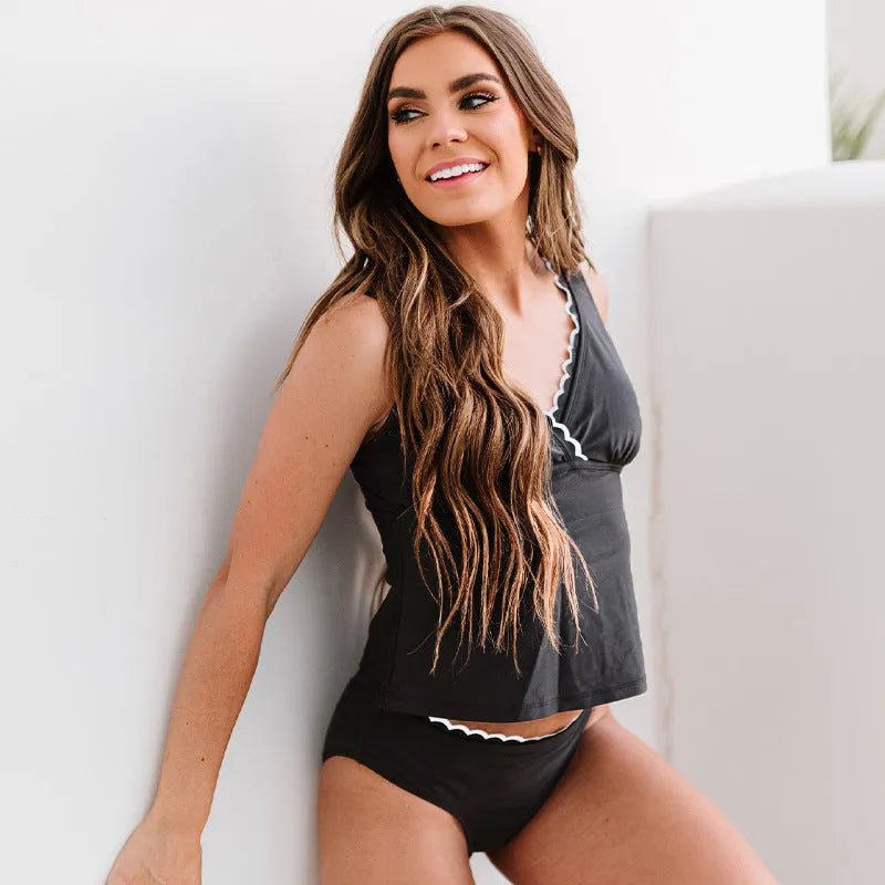Black solid colour women's split bikini swimsuit set on a mannequin.