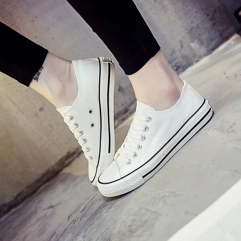 Women's casual canvas shoes in solid black, white-black, or white-red colour options