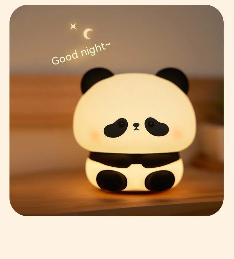 Panda LED night light with soft silicone head, USB rechargeable, touch control, colourful lights, on a bedside table