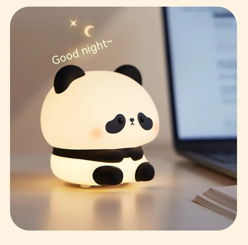 Panda LED night light with soft silicone head, USB rechargeable, touch control, colourful lights, on a bedside table