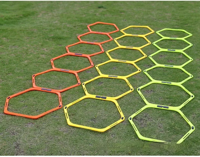 Six foldable hexagon agility training rings in green, orange, and yellow colours for football drills.