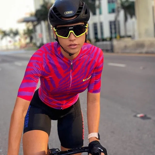 Attaquer women's kaleidoscope pattern cycling jersey and pants set on a model.