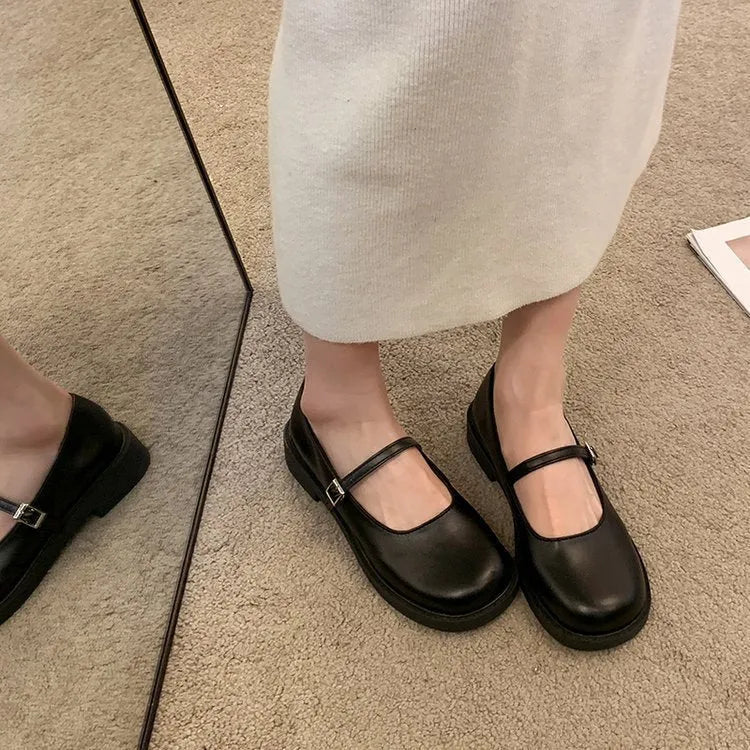 Women's solid colour flat shoes with round toe in red, black, and grey options