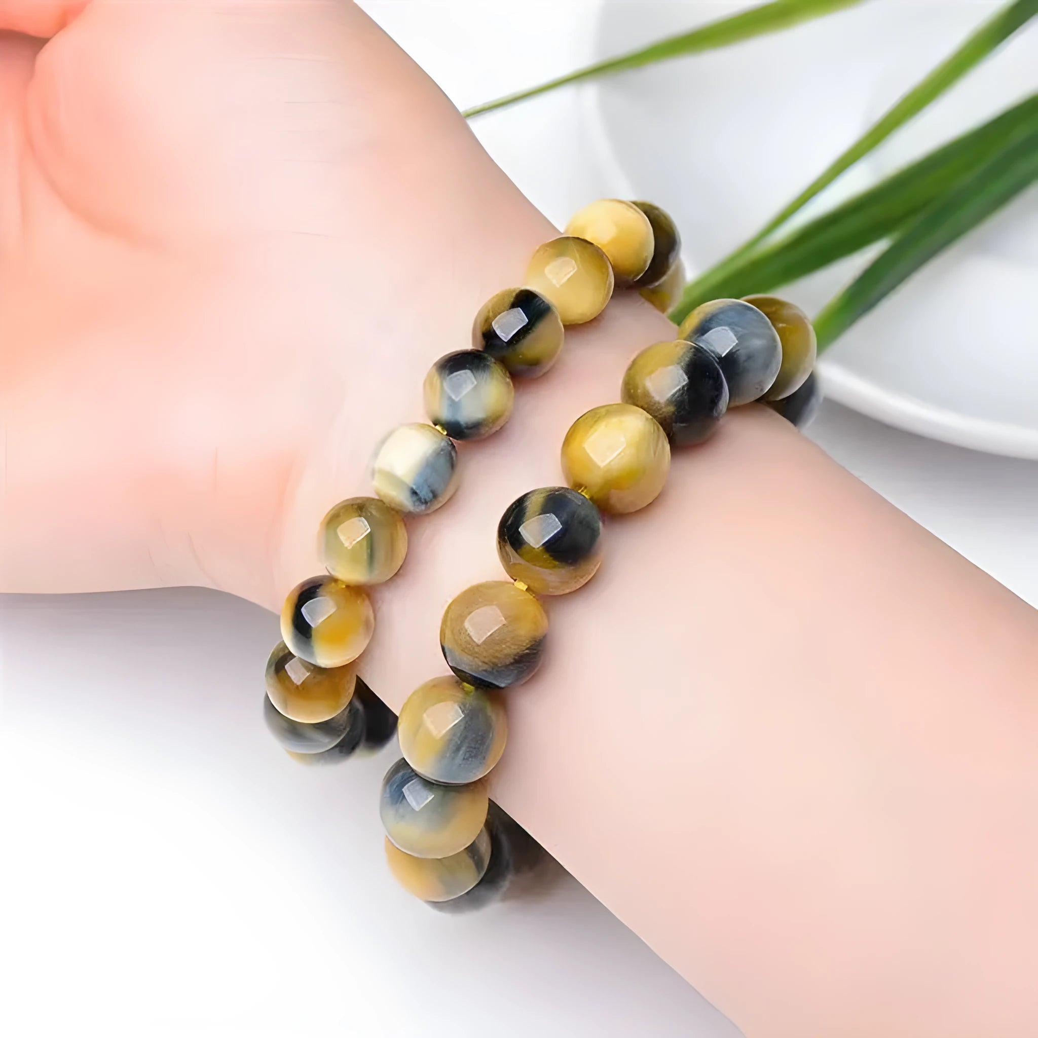 Fantasy Tigereye agate beaded bracelet with round geometric beads on a wrist, showing natural stone colour.