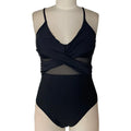 Women's black mesh spliced backless one-piece swimsuit on model