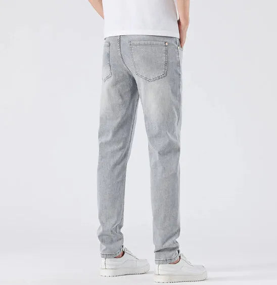 Men's light grey slim straight leg jeans with cotton no-iron finish, straight cut with small tube cuff