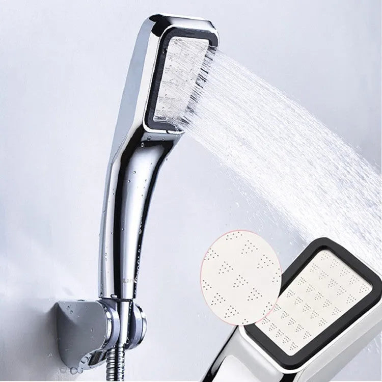 Orange hand-held rain shower set with wall bracket and connection hose
