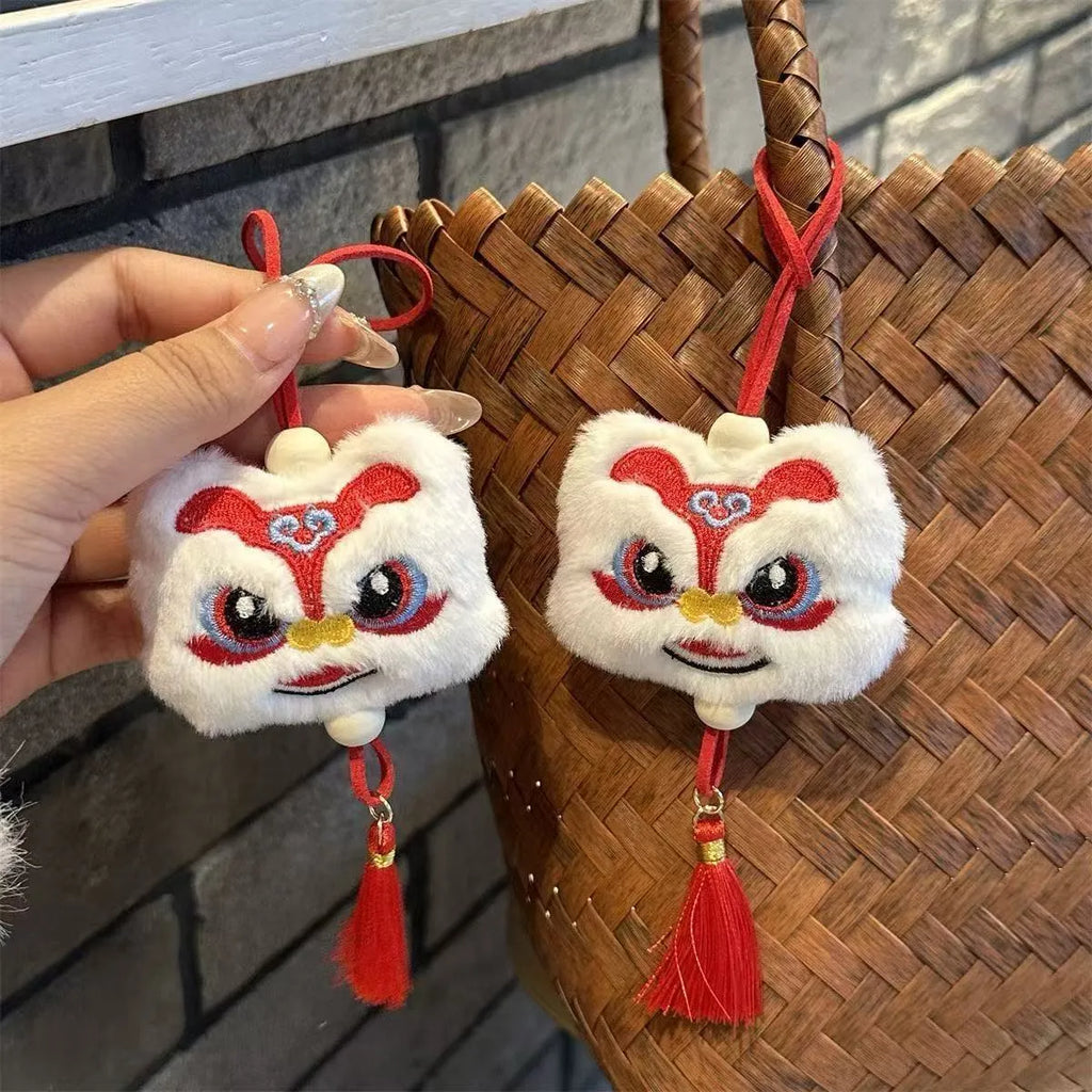 Blue and yellow handmade plush lion keychain with star stones and tassels in Chinese cartoon style