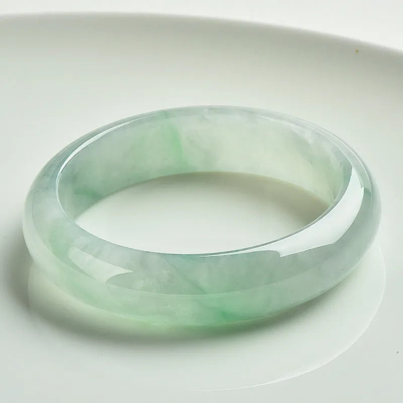 Light green jade bracelet showing natural stone material and simple design for unisex wear
