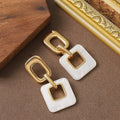 Hollow geometric square earrings with chamfered corners in silver or black