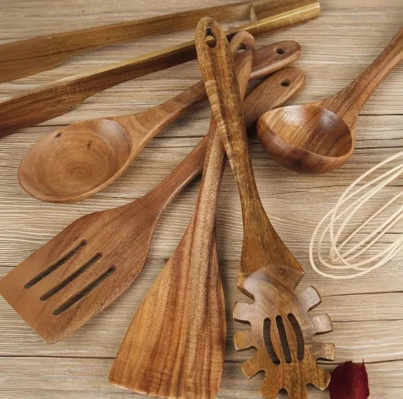 Seven wooden cooking utensils with non-slip handles designed for non-stick pans