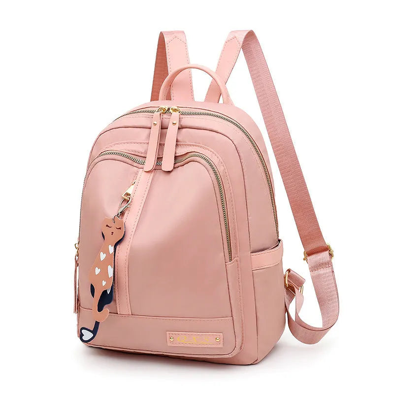 Women's casual nylon backpack in black or pink with square shape, showing external pocket and double straps.