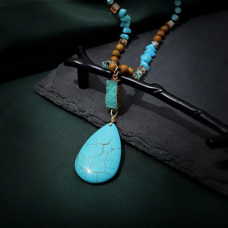 Turquoise water drop shaped pendant necklace with geometric design and ball bead chain