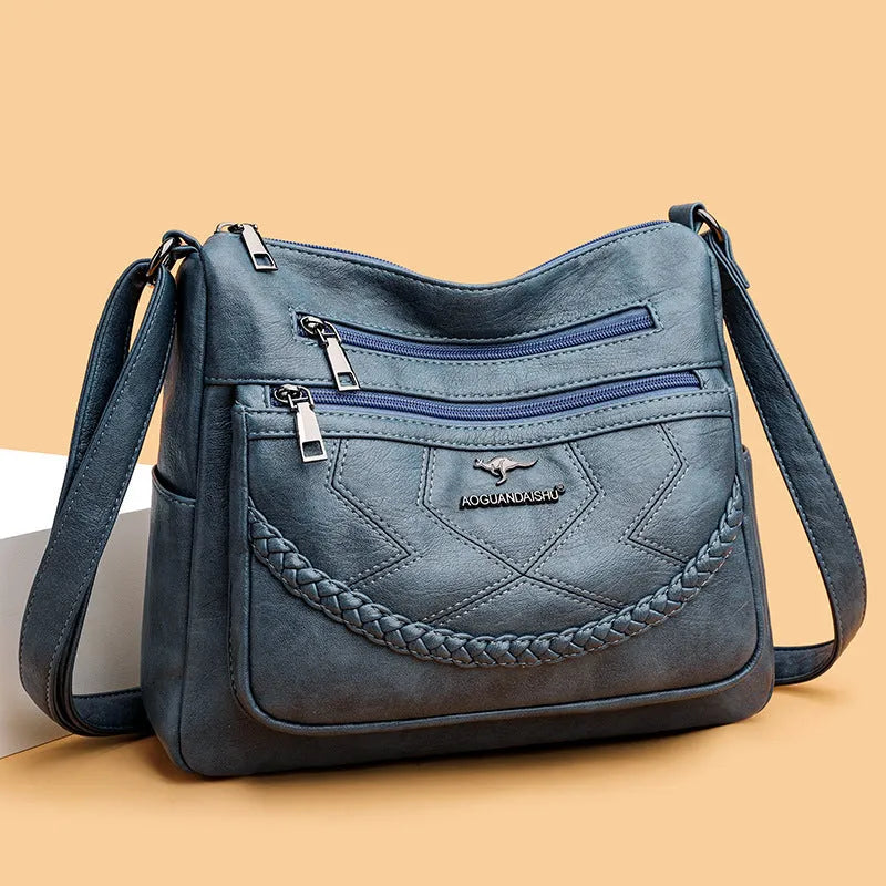 Women's black PU leather crossbody shoulder bag with large capacity and zipper compartment