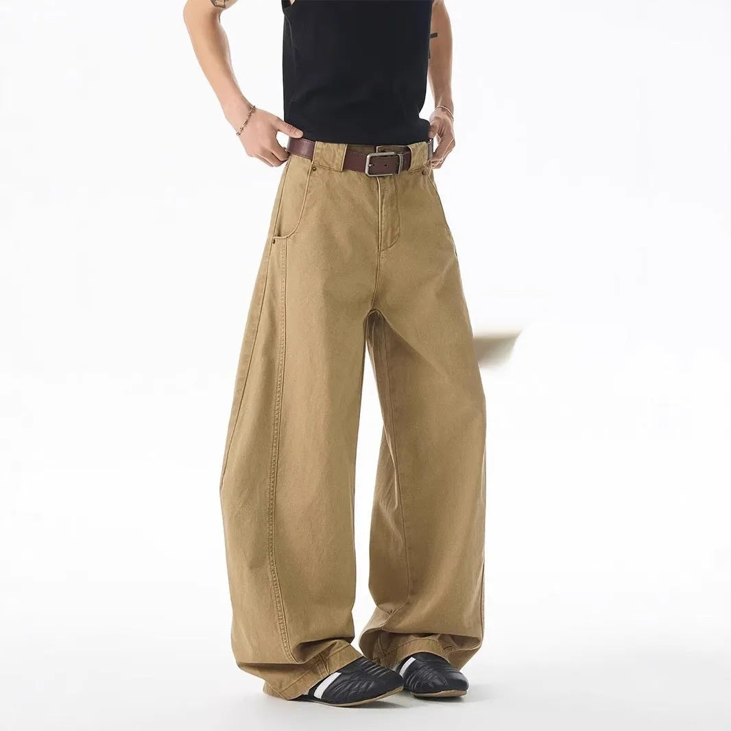 Brown loose fit straight leg men's jeans with a button fly on a mid waist.