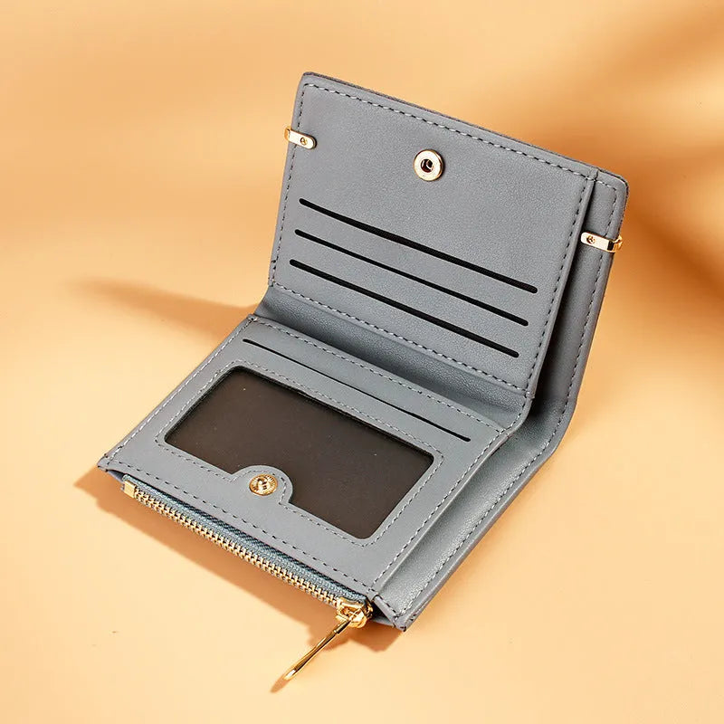 Short ladies wallet with zipper closure showing multi card slots and compartments in PU leather