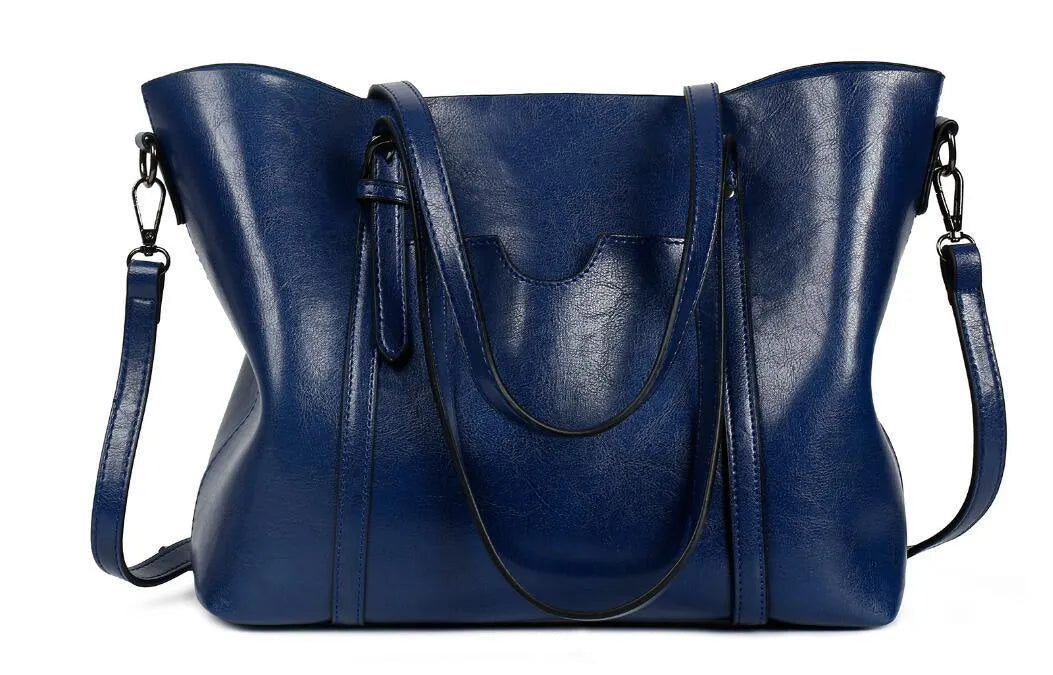 Retro style women's messenger bag in PU leather, shown in light blue colour