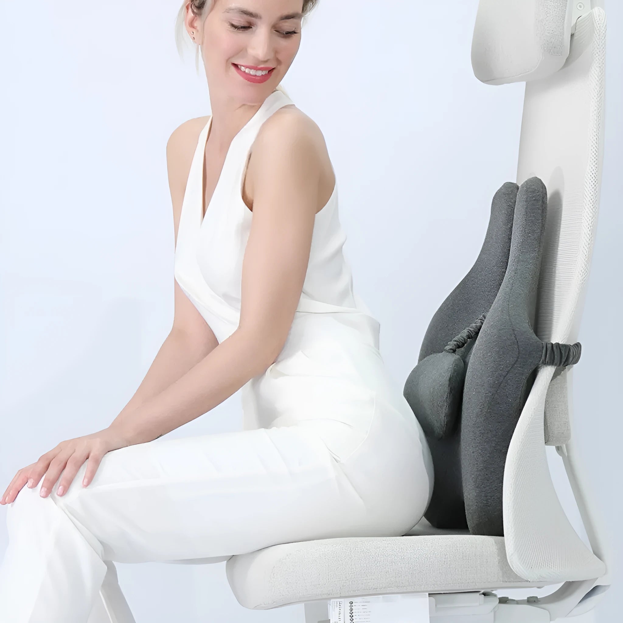 Memory foam car cushion with adjustable lumbar support in black colour on vehicle seat
