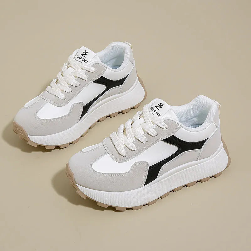 Women's low-top platform running shoes in black, red, or grey with lace-up front and flat rubber sole.