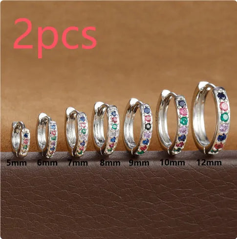 Geometric circle zircon perforated stud earrings in gold, rose gold, and silver colours showing perforated pattern detail