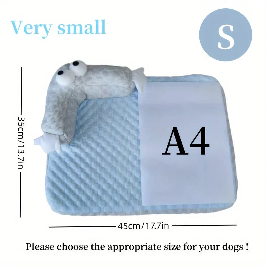 Blue pet cushion with large monster face design for dogs and cats on a wooden floor.