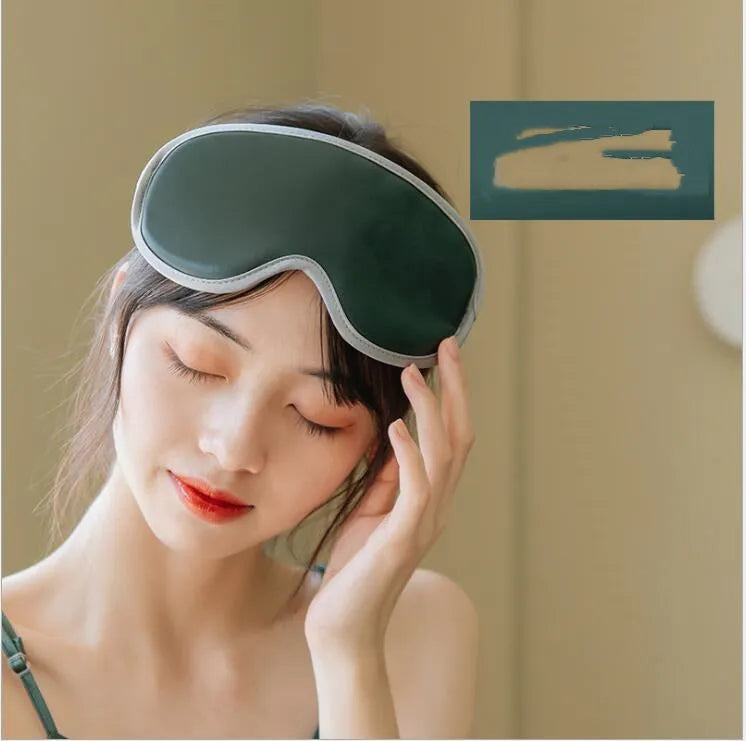 Pink and green portable steam sleep massage goggles showing suede exterior and super fibre interior.