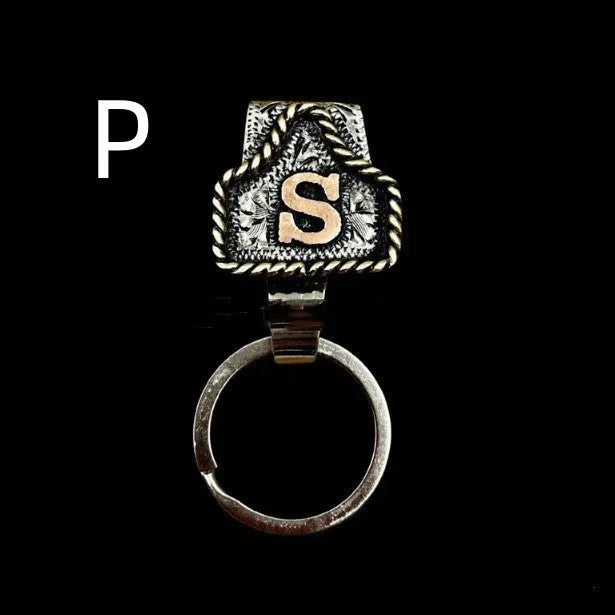 Handmade metal keychain with a cow tag charm in one of 26 available colour options.