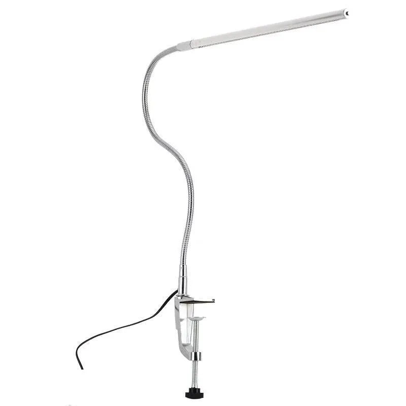 Silver USB-powered LED clip-on table lamp with long arm extended, showing the lamp head and clip mount.