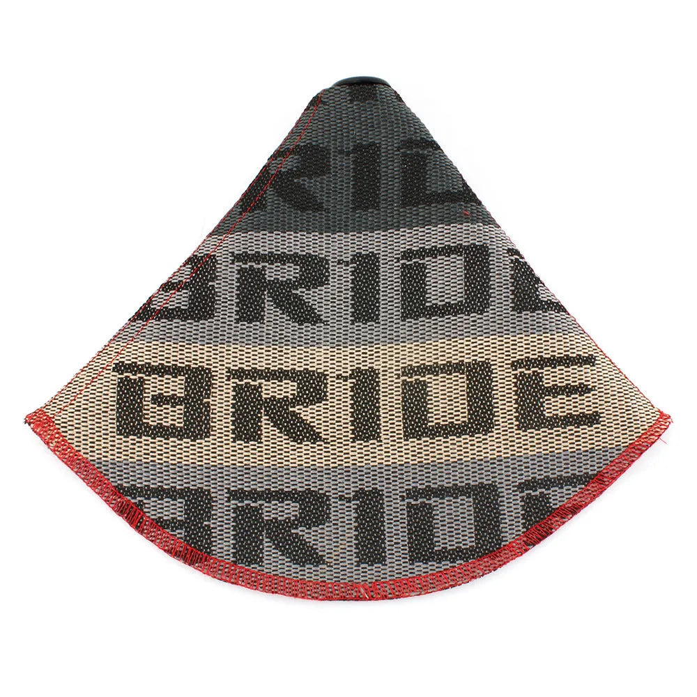 Canvas dust cover draped over a racing bucket seat in a vehicle interior.
