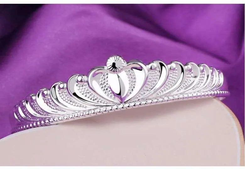 Silver electroplated crown bracelet for women on white background