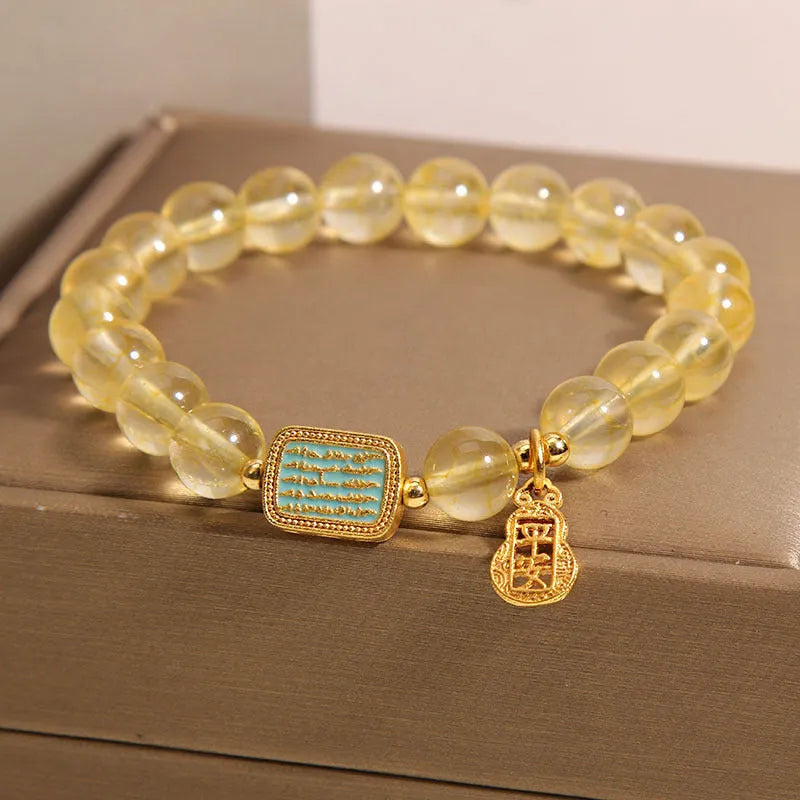 Women's citrine crystal bracelet with rhinestone decorative details showing natural yellow colour