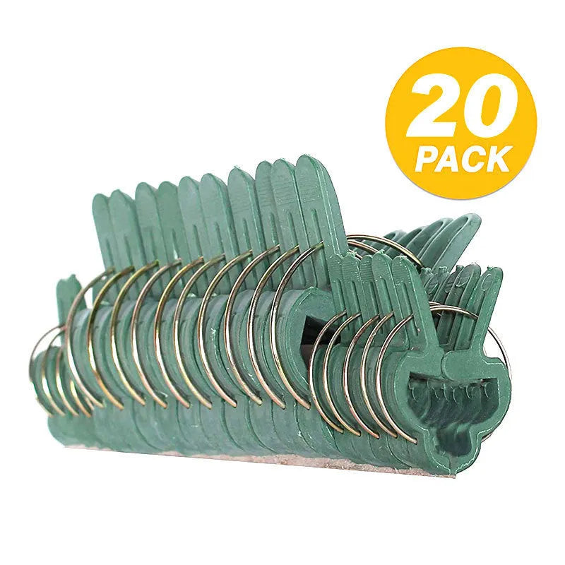 Green plastic and zinc plant fixing clips for supporting climbing beans and tomatoes.