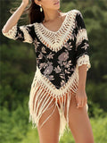 Women's apricot sun protection shirt with V-neck collar and hollow-out sleeves on a hanger