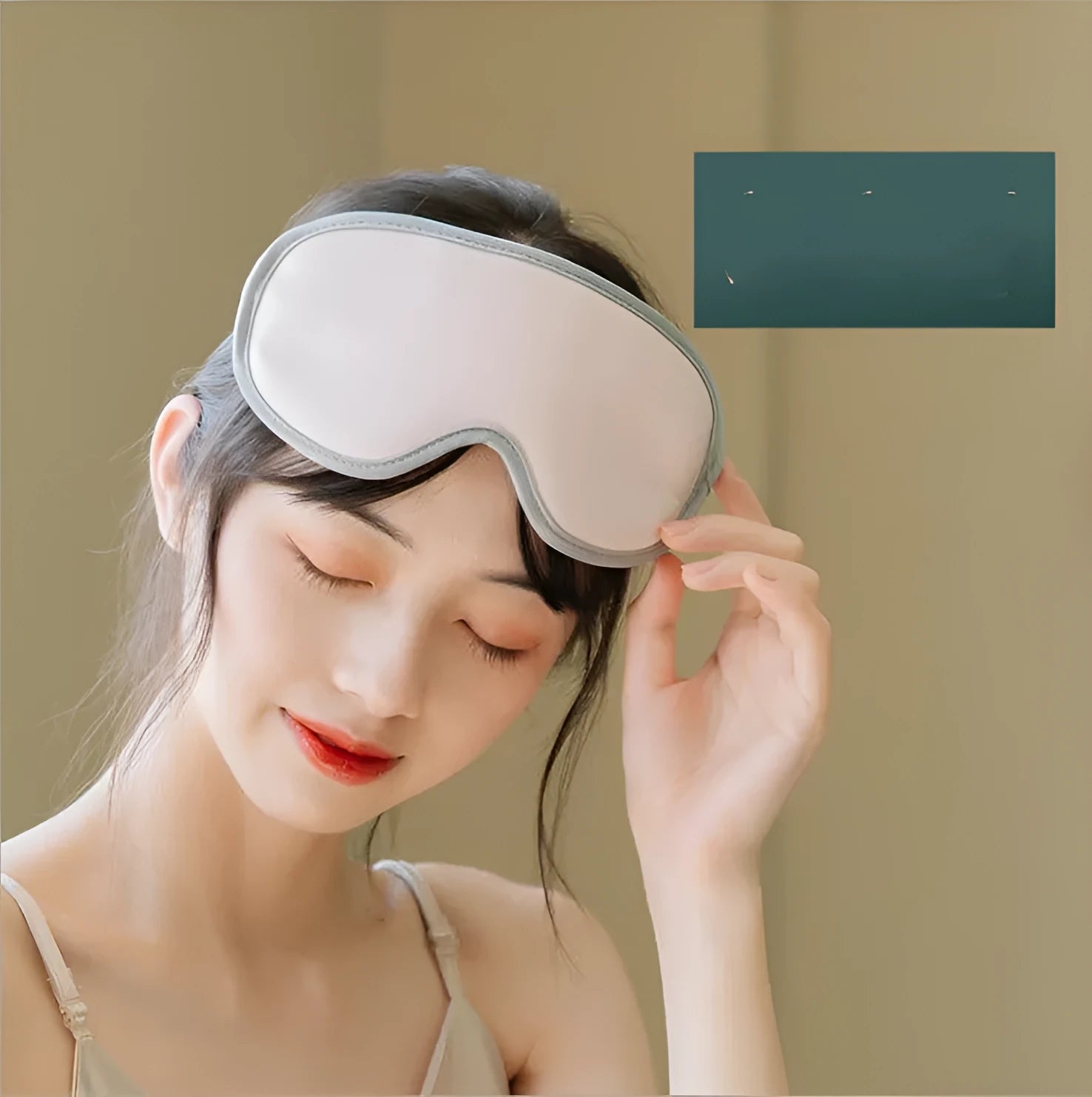 Pink and green portable steam sleep massage goggles showing suede exterior and super fibre interior.