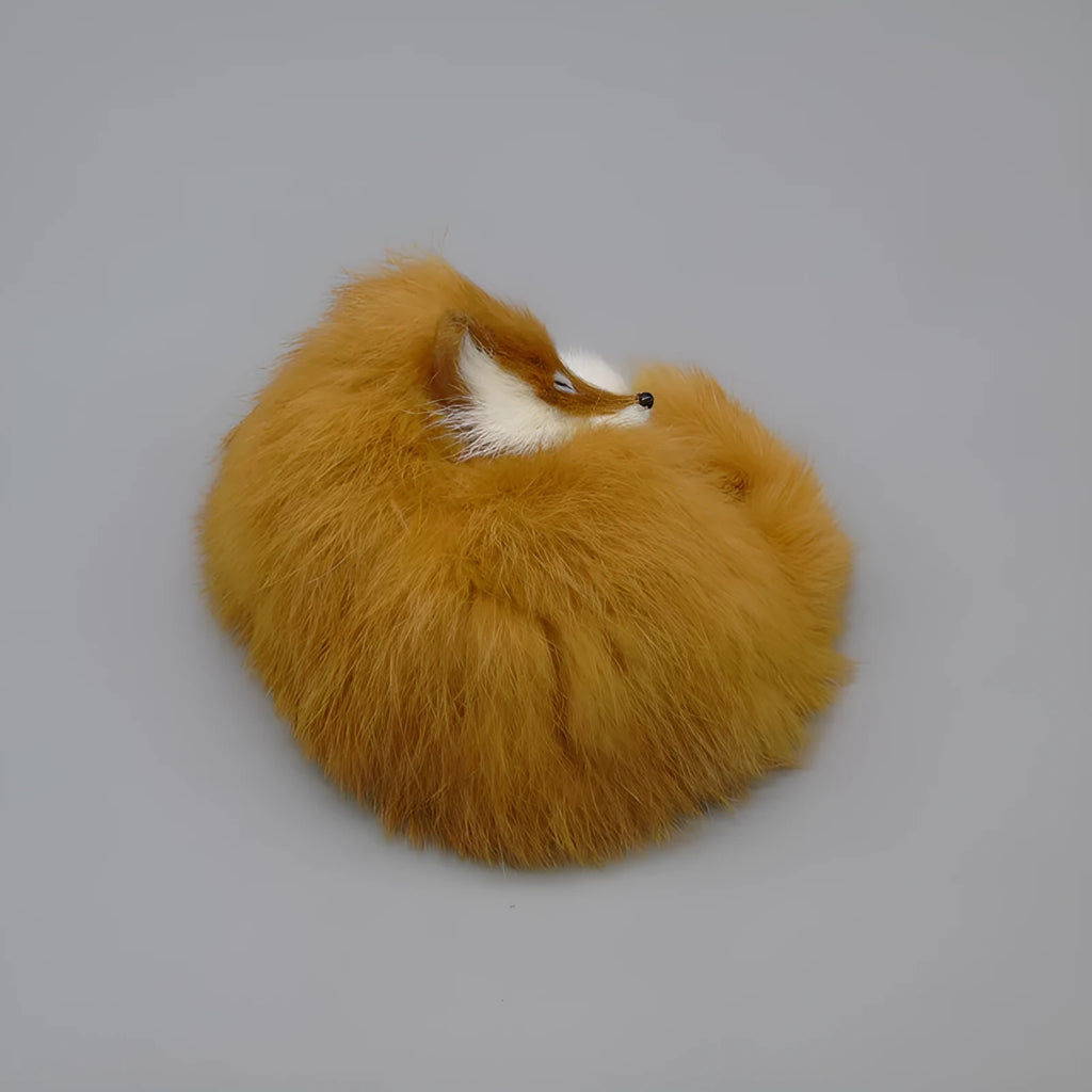 Artificial white fox fur car decoration on vehicle dashboard showing soft texture and compact size
