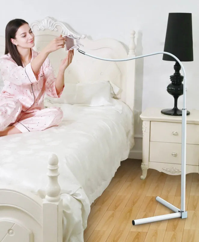 Black mobile phone bed bracket mounted bedside with adjustable overhead support shelf holding smartphone