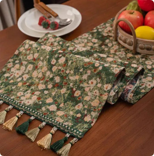 Country European retro style table flag with long handwoven tassels draped over a wooden sideboard.