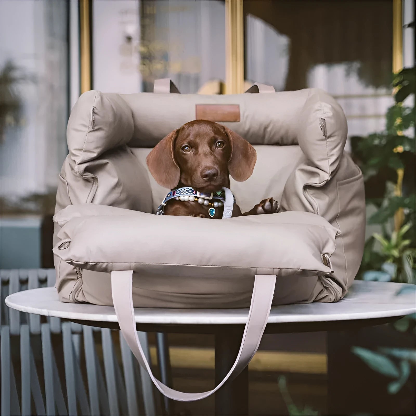 Green waterproof PU leather dog car nest with removable cover, shown in a car footwell.