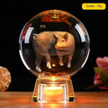 White crystal zodiac decorative ball with electronic base lighting showing Chinese-style animal design