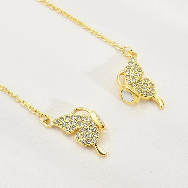 Gold titanium steel clavicle necklace with magnetic butterfly pendant on twisted chain