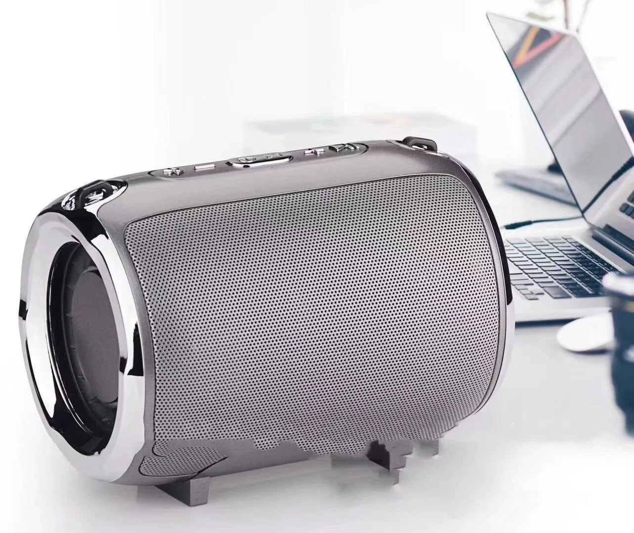 Portable plug-in subwoofer with metal casing in choice of five colours, showing button controls.