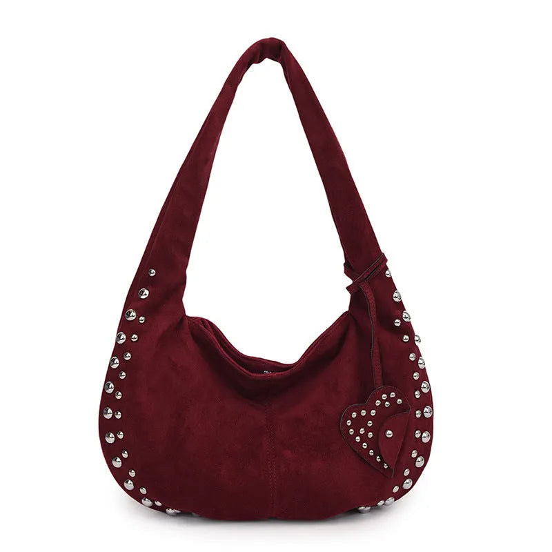 Strapless soft plush underarm tote handbag in a retro style, shown in one of its colour options.