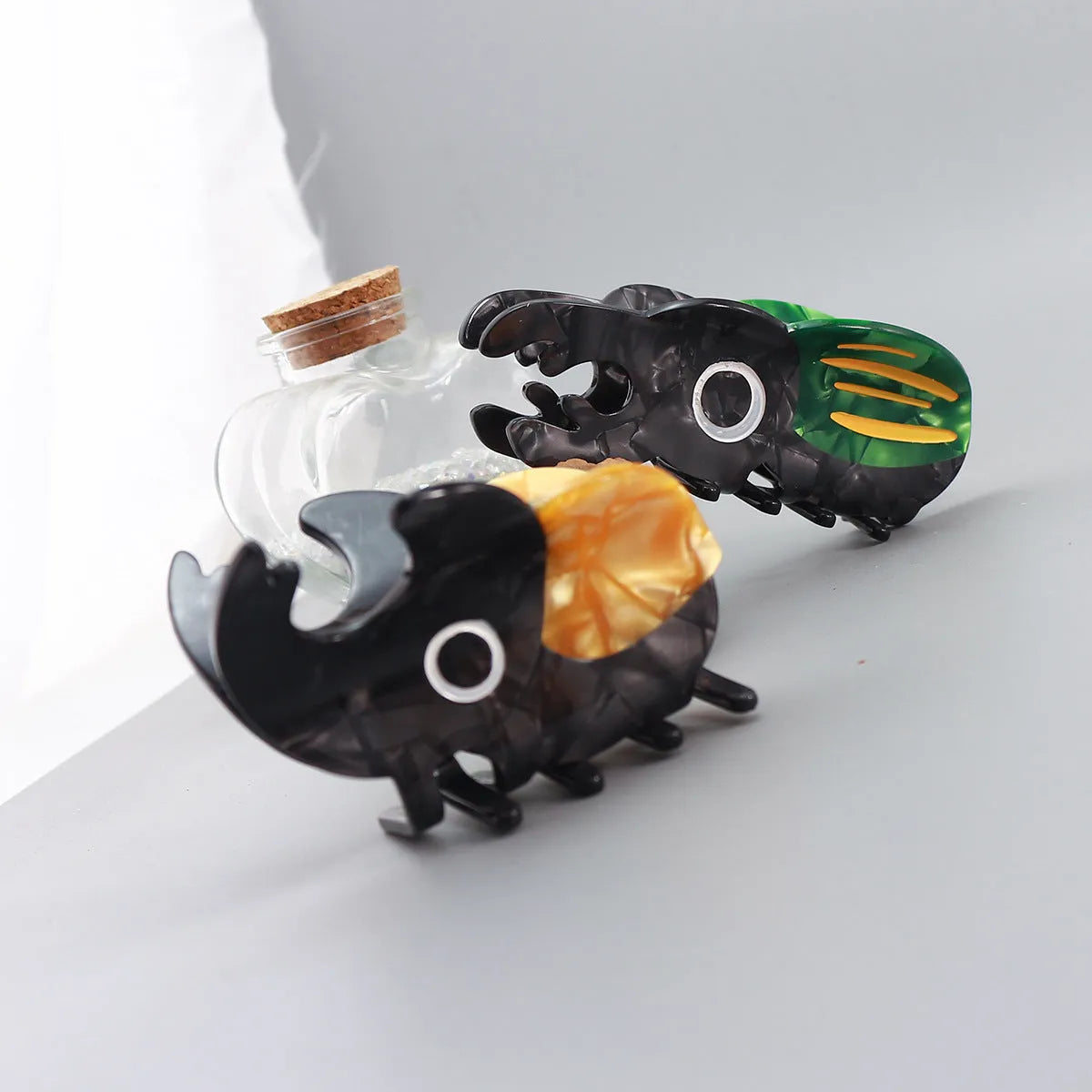 Handmade cellulose acetate insect beetle grip desk accessory with cartoon caterpillar design