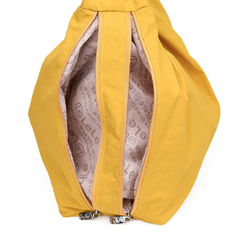 Women's soft nylon underarm bag in a heart shape, shown in black, blue, khaki, and yellow colour options.