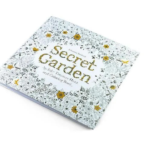 Adult DIY colouring book Secret Garden model open to a detailed black and white cartoon illustration page.