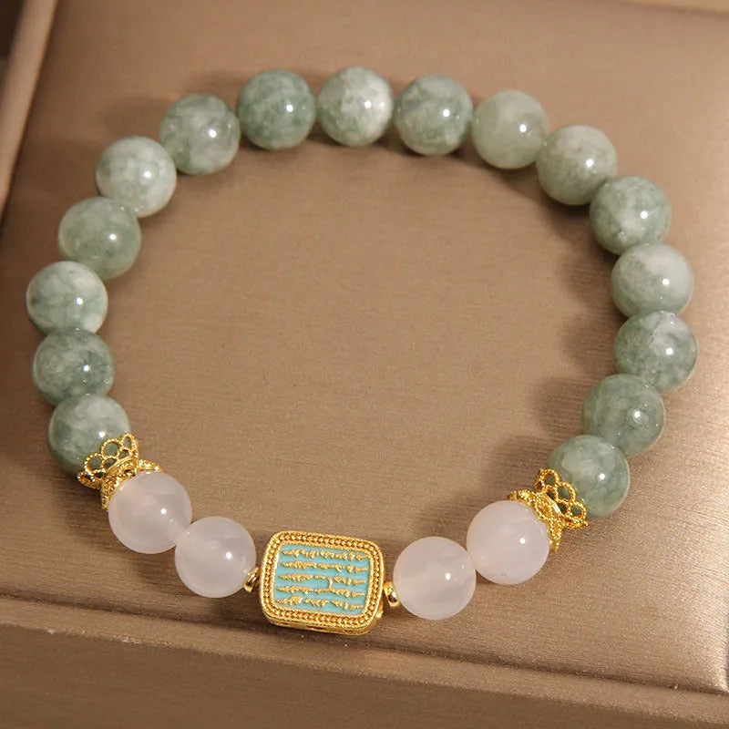 Women's oil green emerald crystal bracelet with five scripture bead design on wrist