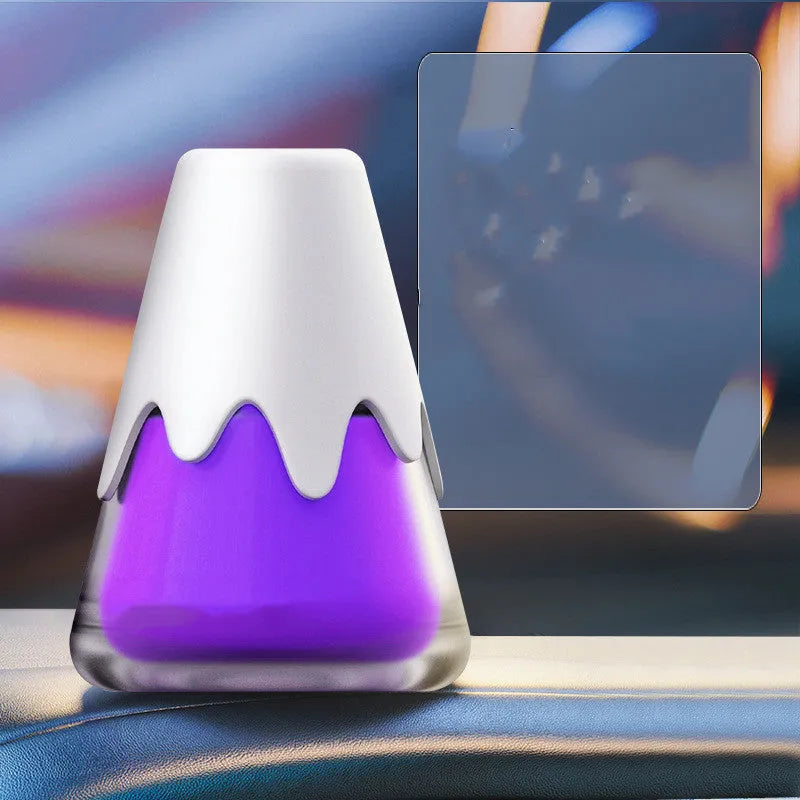 Snow Mountain Cup car air freshener in glass paste case showing four colour and scent options.